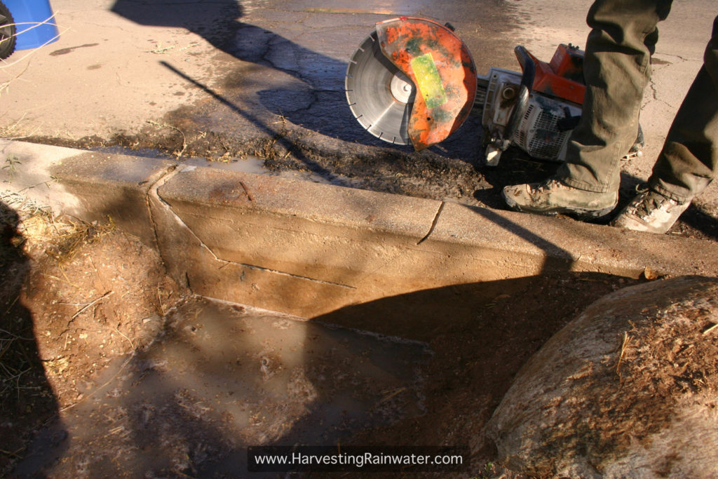 Fig. 3. Horizontal cut on inside of curb done. Right-hand angled cut from inside still needs to be done.