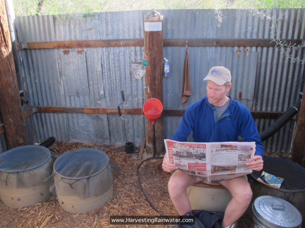 Figure 13. Legal, permitted site-built compost toilet. When composting chamber/drum is filled, toilet platform is rotated to next of four 55-gallon plastic drums/compost chambers half-buried in the ground. 