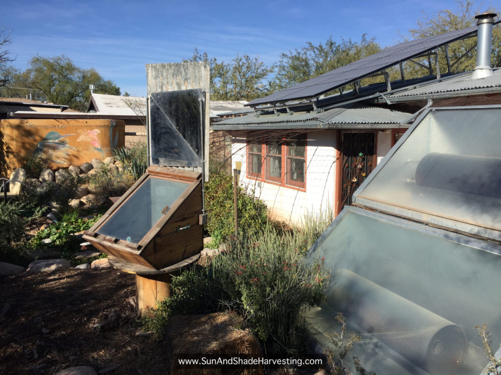 Figure 14. Solar oven, solar water heaters, and solar panels at main house